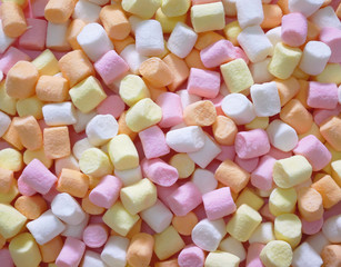 Background or texture of colorful mini marshmallows.