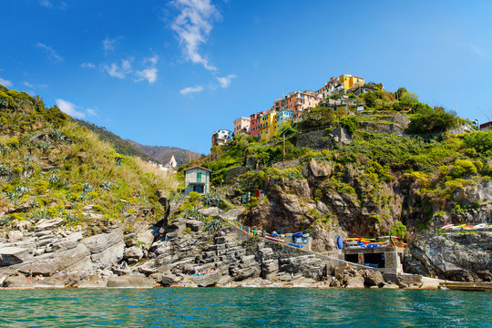 Corniglia, Liguria, Italy fisherman village, colorful houses on sunny warm day. Monterosso al Mare, Vernazza, Corniglia, Manarola and Riomaggiore, Cinque Terre National Park UNESCO World Heritage