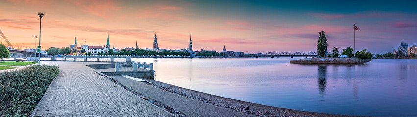 Panoramic view on historical district of old Riga city from left bank of the Daugava river