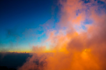 Fototapeta premium Sunset in sky and cloud, beautiful colorful twilight time with silhouette of mountain.
