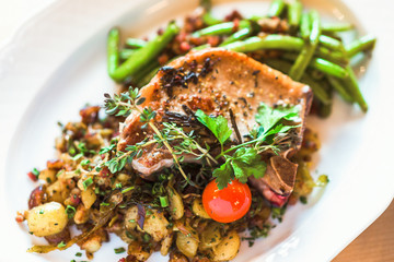 Fried pork on the bone with potatoes and green beans
