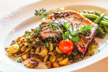 Fried pork on the bone with potatoes and green beans