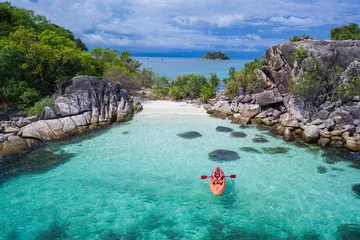 Foto op Canvas Aerial drone view of man kayaking in crystal clear lagoon sea water during summer day near Koh Kra island in Thailand. Travel tropical island holiday concept © stryjek