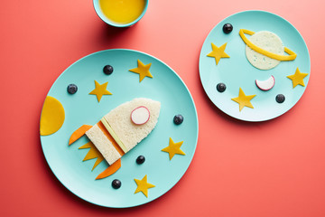 Blue plates with funny breakfast.