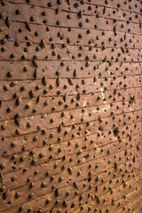 Rusty door riveted with nails in Citadel of Tripoli, Lebanon