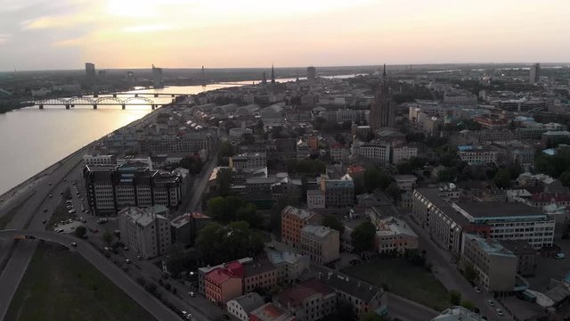Aerial sunset shots of European capital city Riga, Latvia in Spring 2019 - River Daugava and bridges are seen in the background