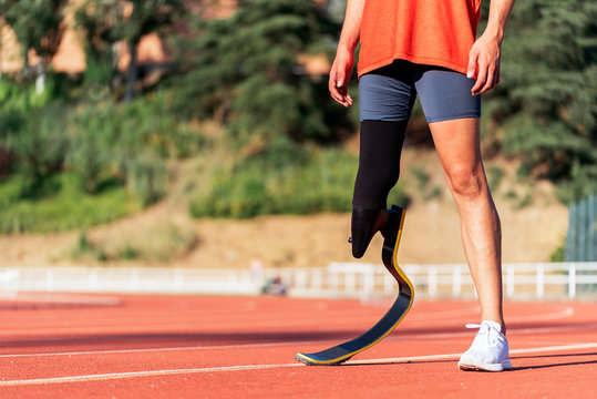 Close up disabled man athlete with leg prosthesis.