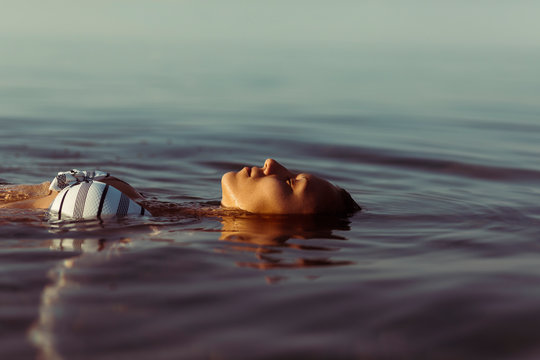 Beautiful woman lying in the water