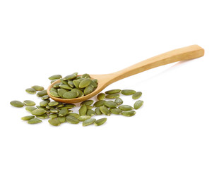  Pumpkin seeds in wooden spoon isolated on white background