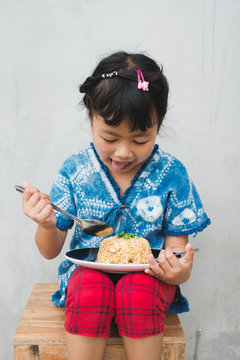 Asian Children Eating Fried Rice