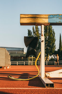 Sport prosthesis leg leaning on hurdle