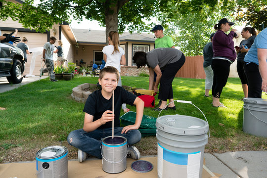 Volunteers Painting a House