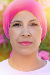 Woman with pink scarf on the head