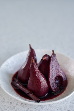 Red wine pears in poaching liquid