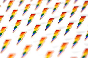 Blurry closeup shot on LGBT lightning bolt rainbow pride symbol isolated on white background. Gay, Lesbian and sexual minority fight for their rights symbol concept. 3D rendering