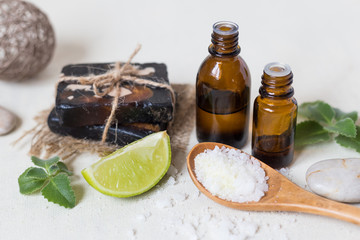 Natural sea salt and handmade soap with body oil on a white background SPA concept.