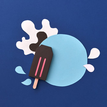 Origami chocolate eskimo with round frame made from colorful pap