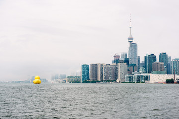 Toronto skyline and waterfront as lake fog and low cloud clear