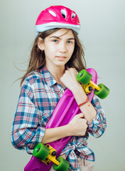 plastic mini cruiser board. Spring. Urban scene, city life. ready to ride on the street. Hipster...