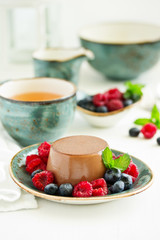 Delicious home-made chocolate dessert Panna cotta. Cream-caramel, caramel custard, with figs.