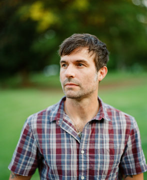 Portrait of a handsome man in a vintage button up shirt