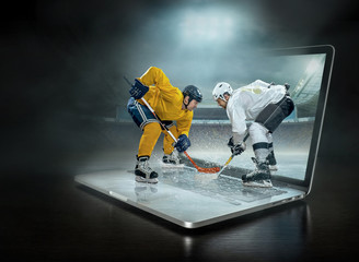 Obraz premium Caucassian ice hockey Players in dynamic action in a professiona