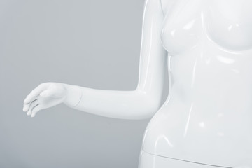 close up view of white plastic mannequin isolated on grey