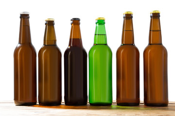 Photo of six different full beer bottles with no labels. Separate clipping path for each bottle...