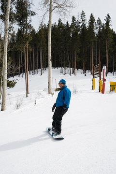 Man Snowboarding Downhill