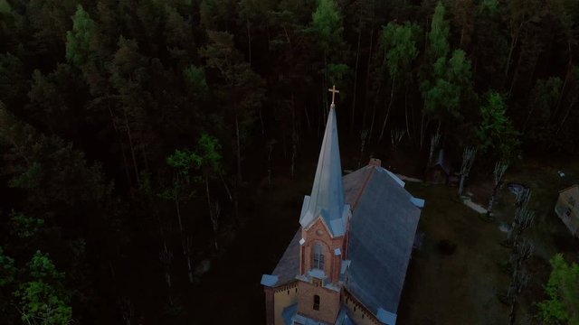 Aerial top view of beautiful church in Jurmala during Golden Hour sunset - Sala Sv. Janis ev. lutheran
