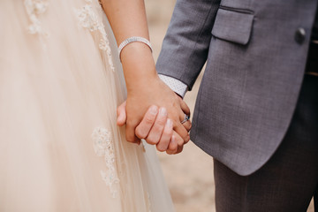 Bride and Groom Holding Hands
