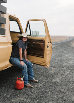 cowgirl on side of road out of gas