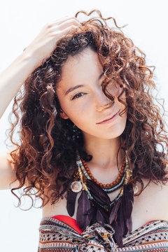 Portrait of a curly hair young woman