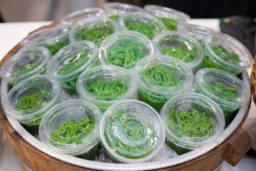 Thai pandan short vermicelli in palm-sugar coconut milk or Lod Chong Singapore, Thai Style sweet soup for Street Food which open booth in Supermarket.  Mostly in green color but some in red pink white