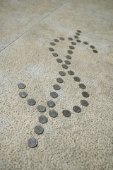 Fototapeta na wymiar US quarter coins in the shape of the dollar sign