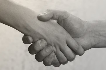 Business agreement handshake on white background. Black and white