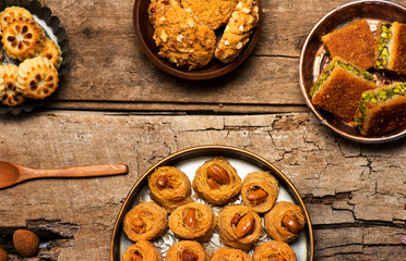 Arabic desserts in rustic bowls top view
