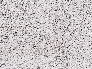 White Texture Rough Cast Plaster. White wall decorated with coarse cement plaster.