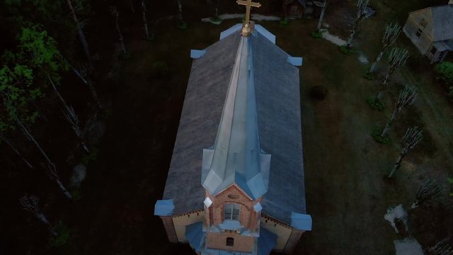 Aerial top view of beautiful church in Jurmala during Golden Hour sunset - Sala Sv. Janis ev. lutheran