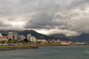 Argentina, Patagonia - a human settlement on the background of mountains at dusk.