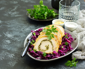 Fried pork loin stuffed with greens and red cabbage.