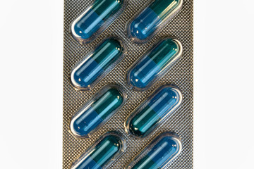 Medical pills. Blue tablet in transparet bister park