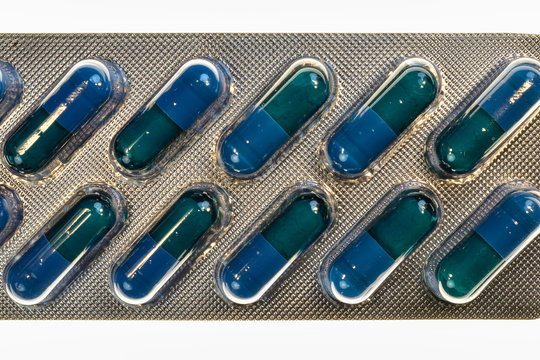 Medical pills. Blue tablet in transparet bister park