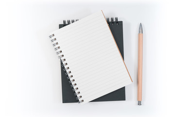 school notebook on a blue background, spiral notepad on a table