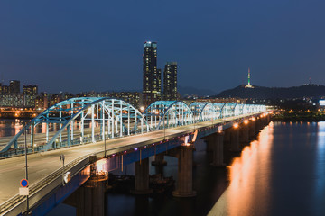 View of hanriver at Dongjak bridge and N Seoul tower at night in Seoul south korea.