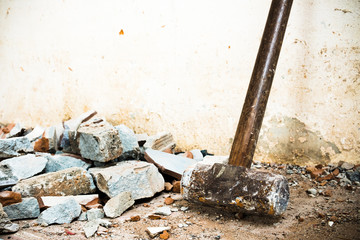 A hammer used to demolish the concrete tile floor and wall of the house before renovation. It heavy and very hard because it made from metal. - obrazy, fototapety, plakaty
