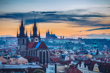 Fototapeta premium Famous Tyn Church on Old Town Square, Prague castle is visible in the background. Prague, Czech Republic