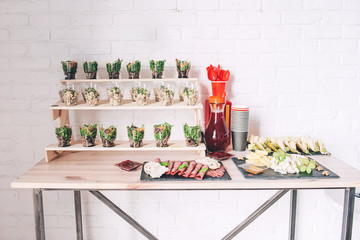 Catering service. Catering food. Table with food at event. Beautifully decorated catering banquet table with different food snacks and appetizers with sandwich.