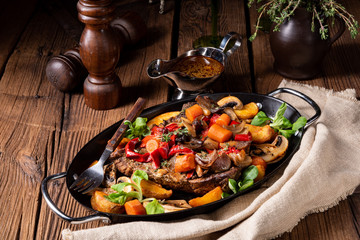 tender beef topped with various vegetables