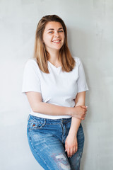 Young beautiful woman in white t-shirt and jeans